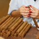 A worker applies an outer wrapper to a cigar at a cigar factory in Miami’s Little Havana neighborhood in 2009 (AP Photo/Wilfredo Lee)